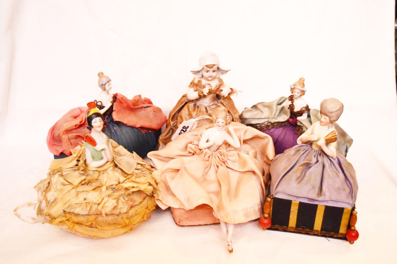 A Collection of Porcelain Headed Dolls