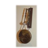 A Brass Wall Gong and Striker