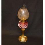 An Oil Lamp, Ruby Coloured Bowl, Decorated Shade