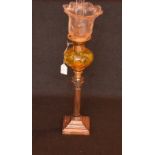 An Amber Glass Peg Lamp