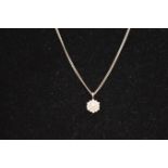 A Silver Chain and a 9ct Gold Cubic Zircona Pendant