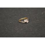 A Superb 18ct Gold and Platinum Two Diamond Twist Ring with Diamond Set Shoulders