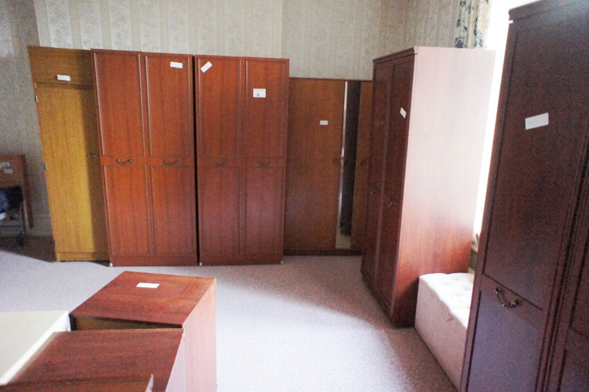 6 various dark wood wardrobes, 10 various dark wood bedroom chests and cabinets and an upholstered