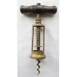 A brass open frame/two pillar corkscrew, marked: The King, patent 6064, with dark-wood handle