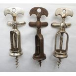 Two white metal open frame/two pillar corkscrews, one marked H. HELICE and one brown metal open