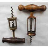 One brass open frame/two pillar corkscrew with dark-wood handle and one bronze coloured open frame/