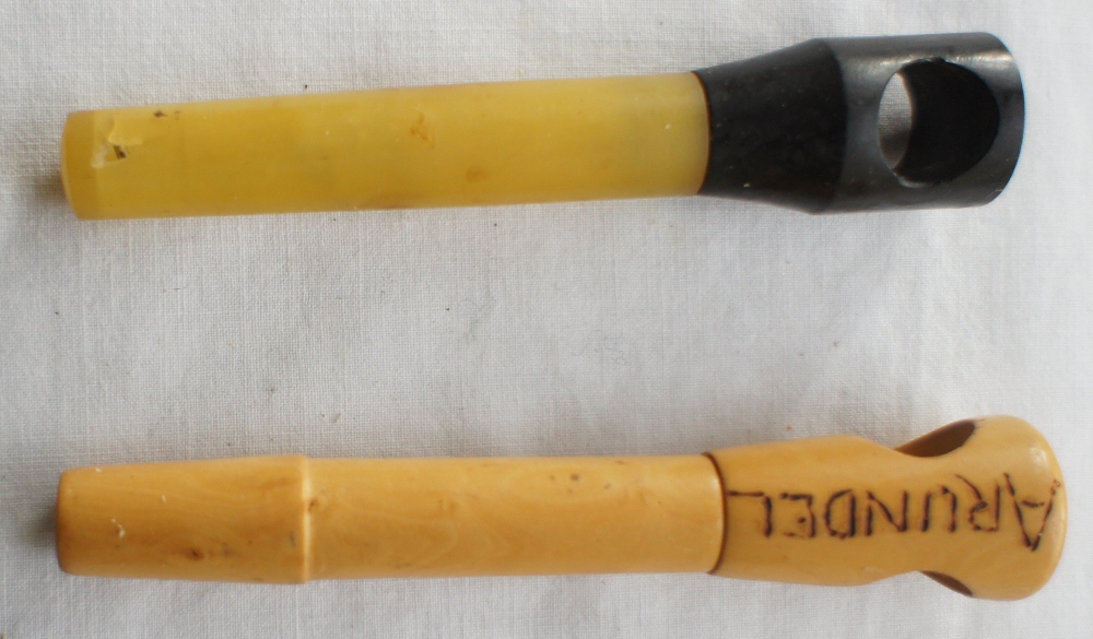 One novelty lightwood foldaway corkscrew marked ARUNDEL and one yellow and black Bakelite foldaway