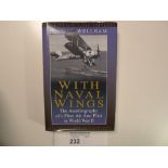 a hardback book “With Naval Wings” by Lt Cmd John Wellham DSC signed by Lt Cmd John Wellham