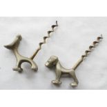 Two small white metal dog corkscrews