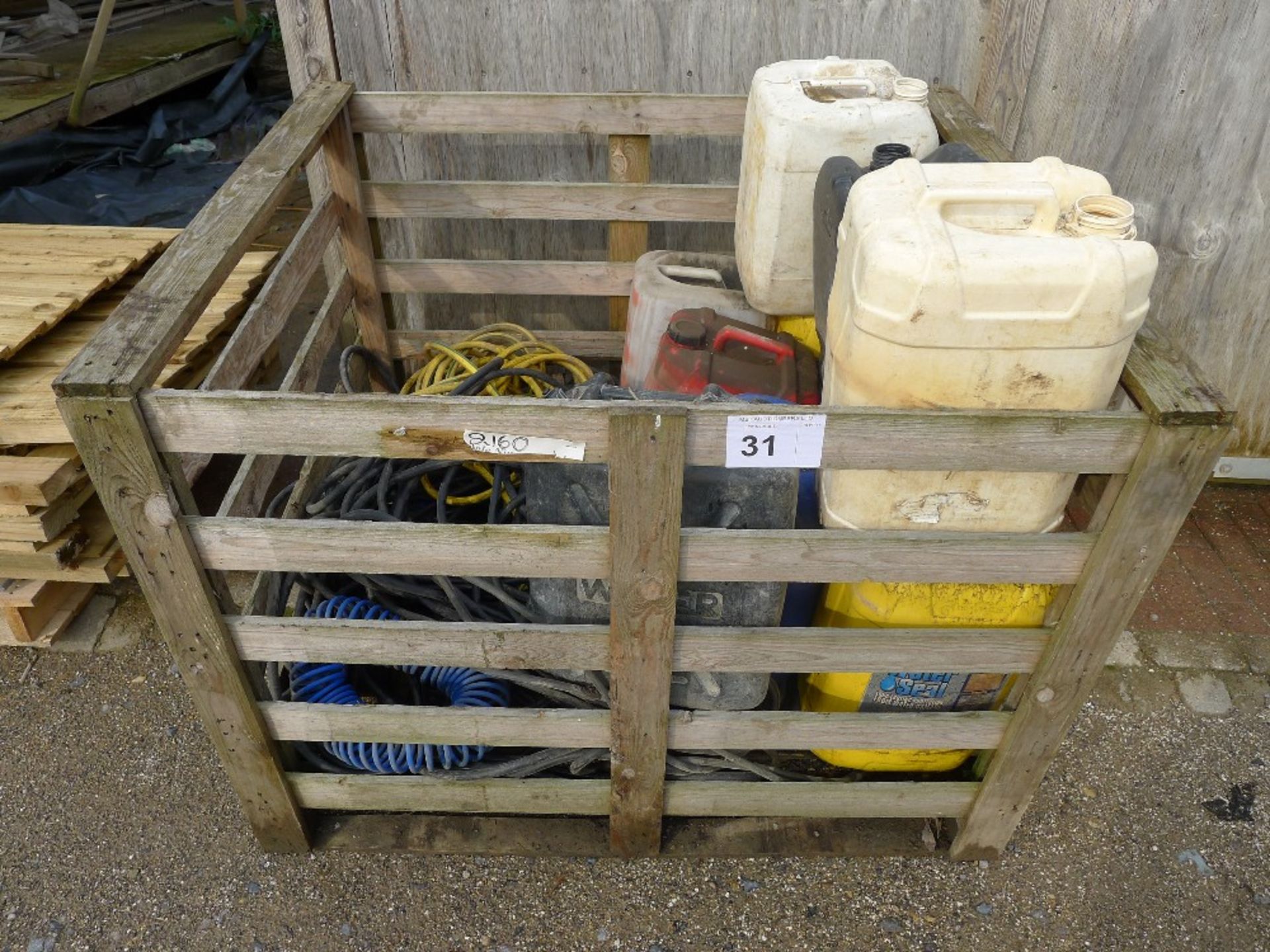 1 wooden pallet crate containing a qty of various items incl. lengths of hose, tubs of Water Seal