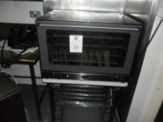 Unox oven with interior shelves/ racking underneath. Glass door. Total height including stand 132cmh