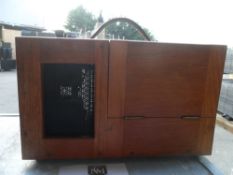 Everett Edgecumbe London, measures cycles per second in wooden casing box. Press a small blob at the