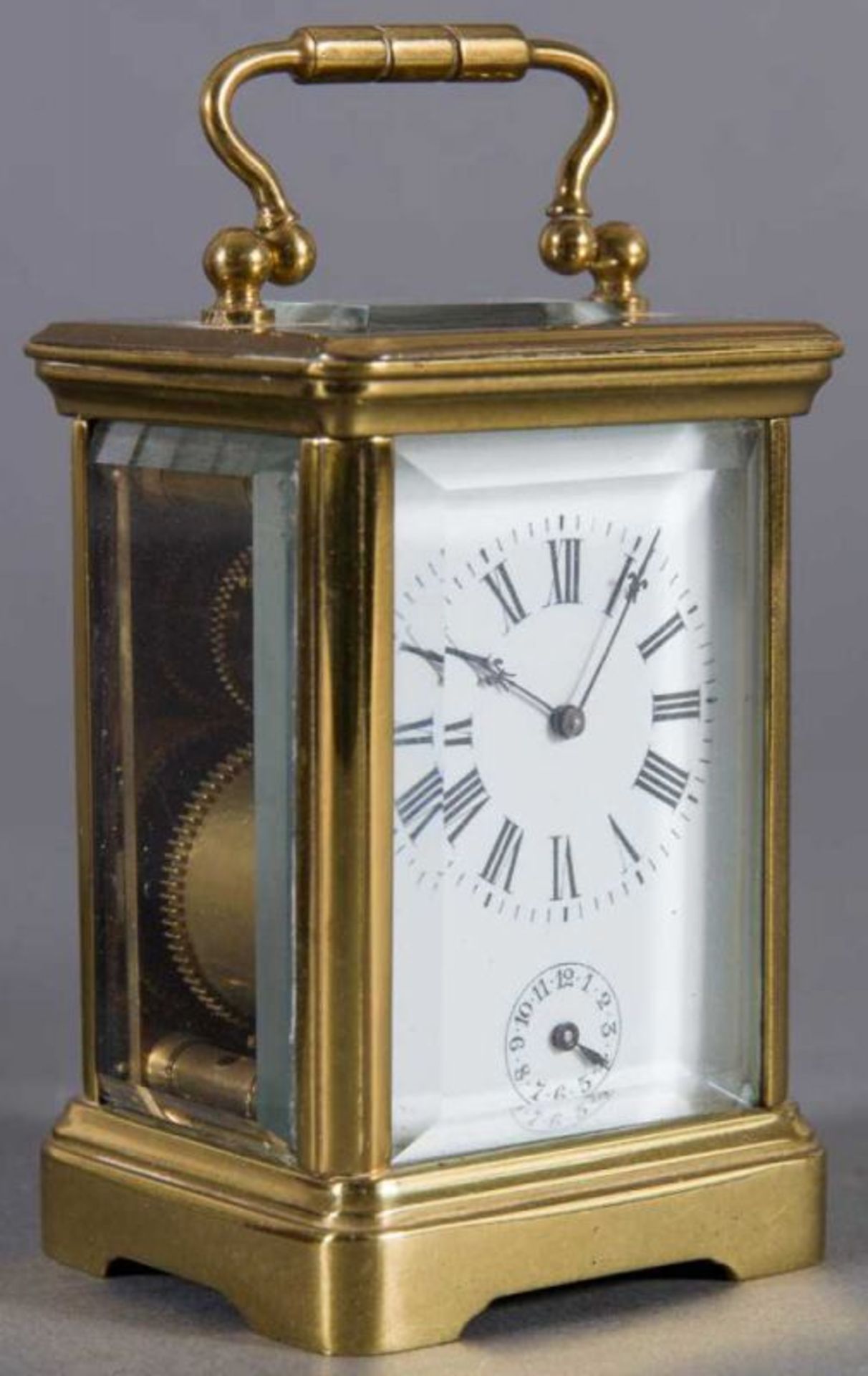 Kleiner Reisewecker sog. "Carriage Clock". Vollverglastes Messinggehäuse. In original Box. Werk