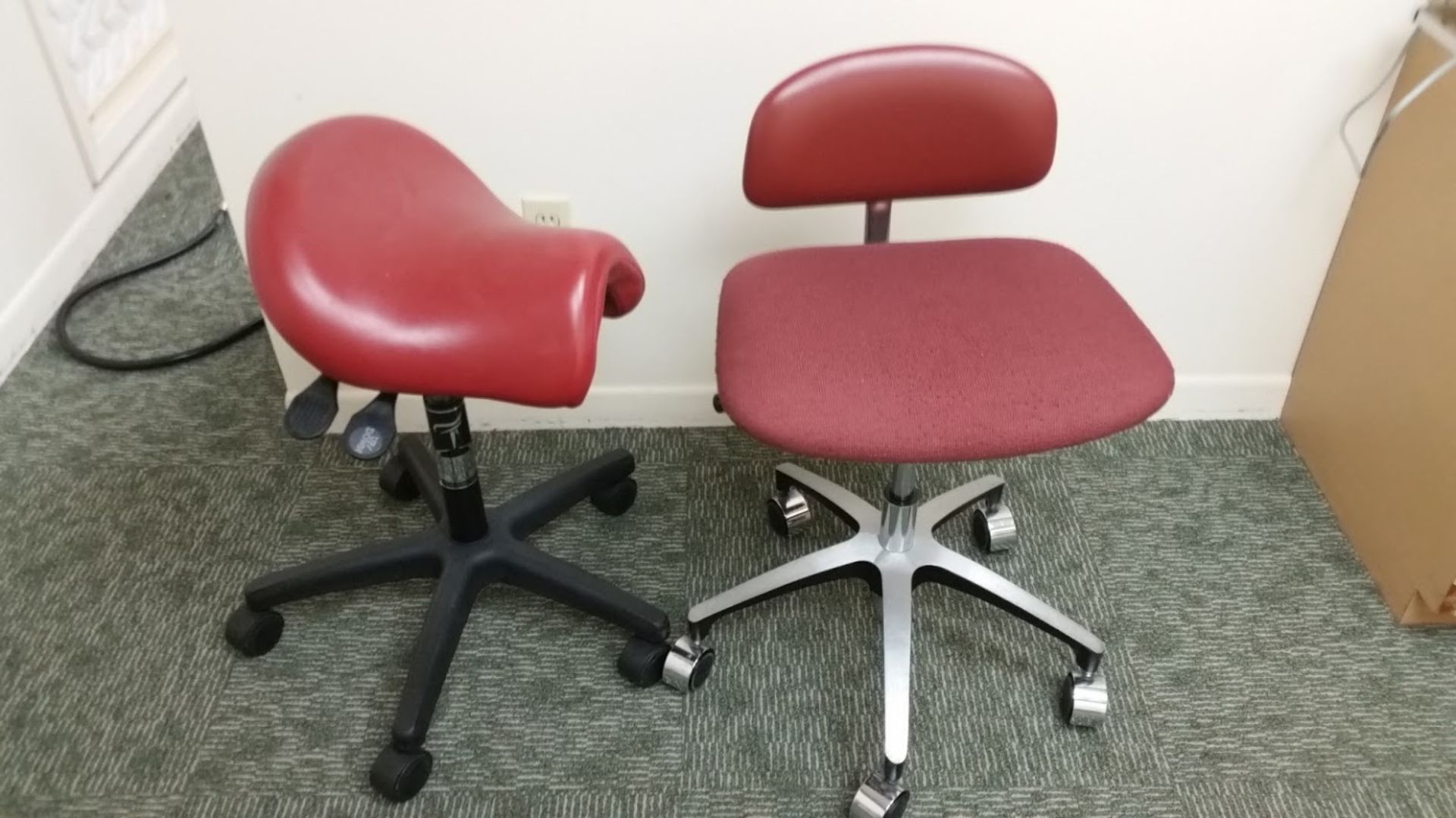 Lot consisting of 2 dental assistant chairs on casters.