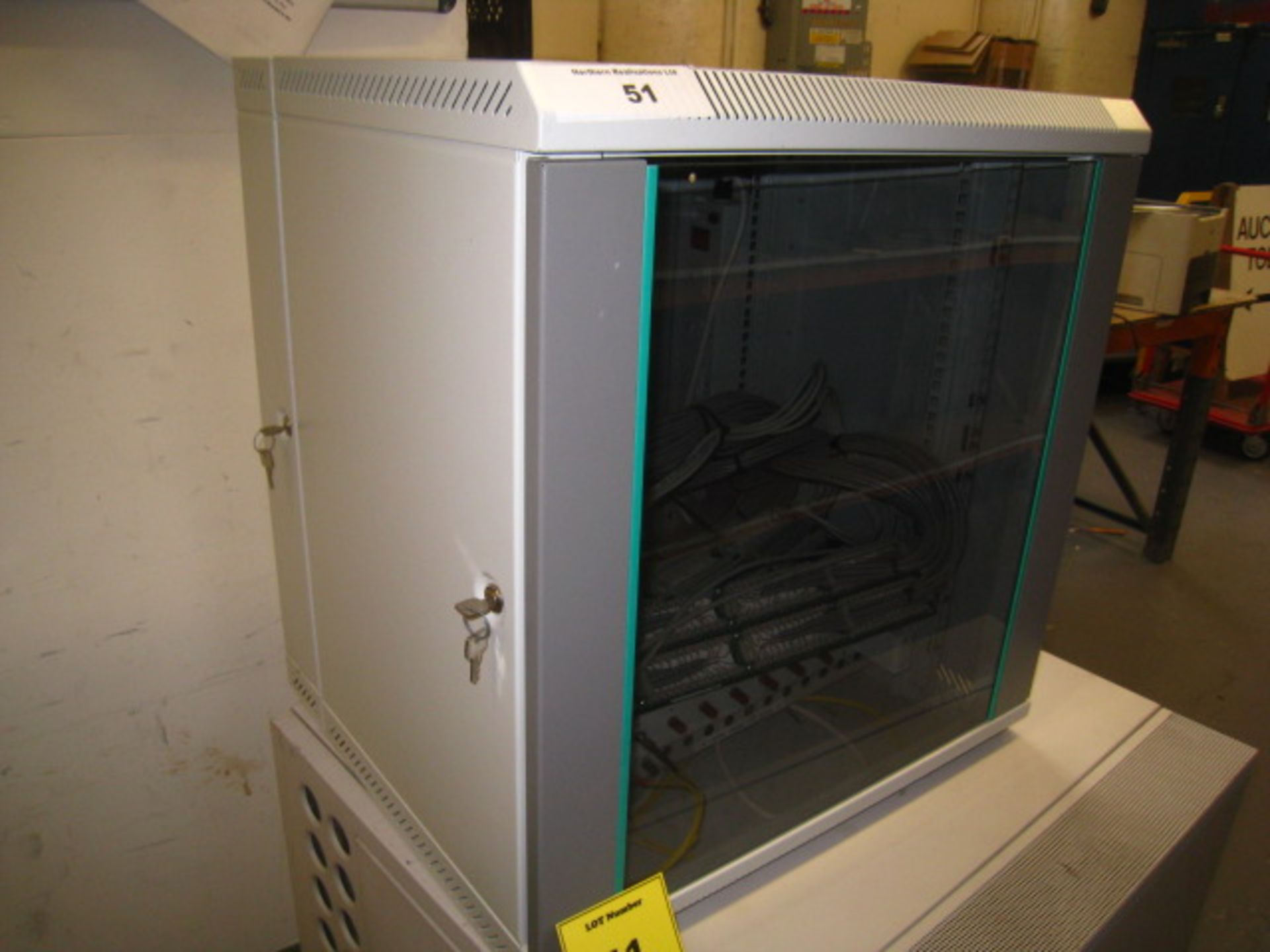 COMMS CABINET IN VERY CLEAN CONDITION WITH KEYS AND CONTAINING PATCH PANELS & A COUPLE OF