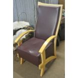 FURNITURE/ HOME - A large modern armchair with dark purple vinyl seat & back.