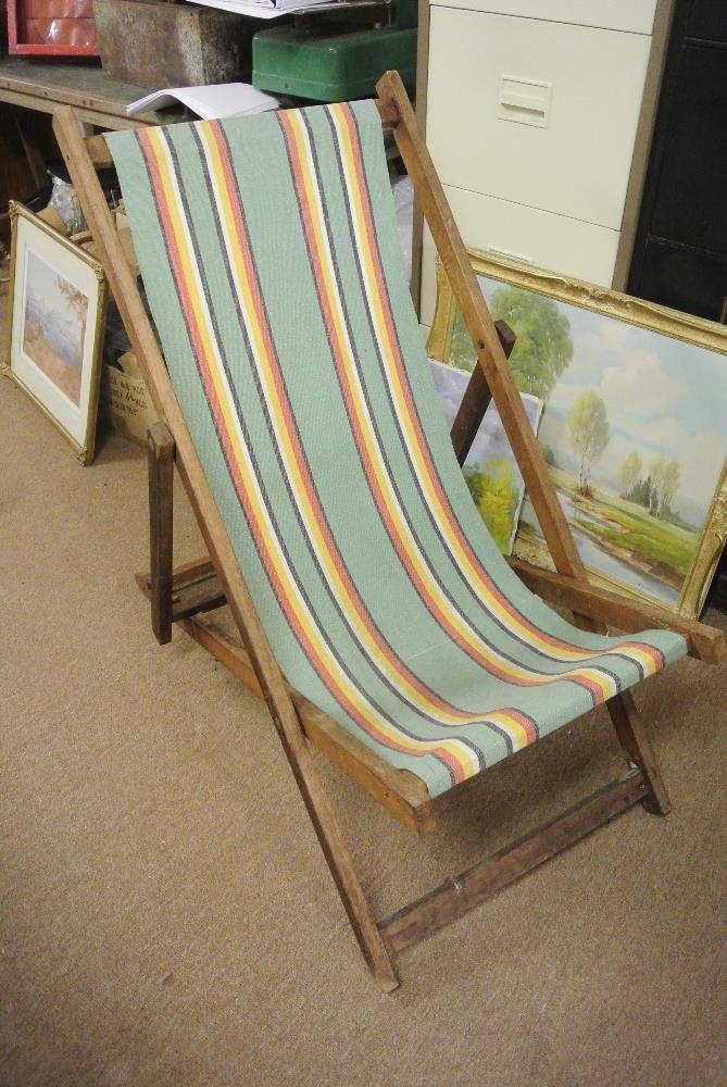 VINTAGE/ RETRO - An original vintage oak framed deck chair with green, black, red, yellow & white