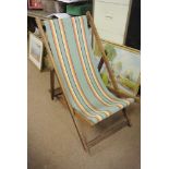 VINTAGE/ RETRO - An original vintage oak framed deck chair with green, black, red, yellow & white