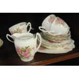 ANTIQUE/ TEACUPS - A collection of 4 matching cups, saucers, side plates, 1 sandwich plate & a