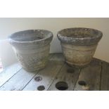 GARDEN/ FURNITURE - A pair of weathered circular planters.