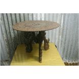 ORIENTAL/ FURNITURE - A small very ornate carved wooden Oriental table with carved Dragon legs.