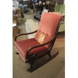 FURNITURE/ HOME - An original vintage Parker Knoll dark Mahogany wood rocking chair with pink fabric