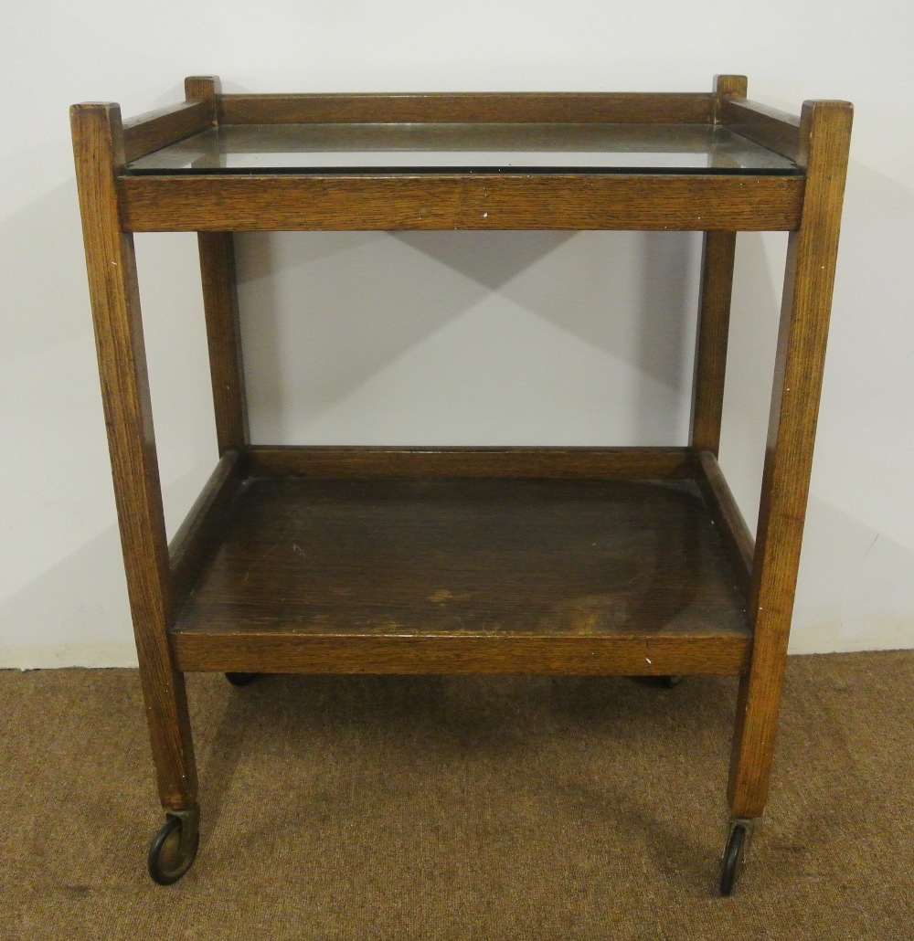 FURNITURE/ HOME - An oak hostess/ tea trolley with glass counter top on original wheels, measuring