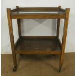 FURNITURE/ HOME - An oak hostess/ tea trolley with glass counter top on original wheels, measuring