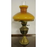 ANTIQUE/ HOME - A beautiful brass oil lamp with orange/brown glass shade. Measures