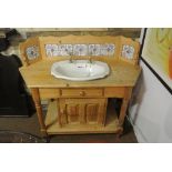 FURNITURE/ HOME - A large pine sink unit with tile backsplash & cupboard. Measures 127x52x100cm.