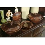 CERAMICS - A collection of brown Portrush Pottery items to include 2 vegetable dishes with lids, 3