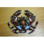 BUTLER & WILSON CRAB BROOCH: A large striking crab pin brooch set with multi-coloured rhinestones in