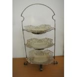 SILVER PLATE - A 3 tiered EPNS cake stand with pi