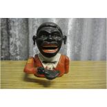 CAST IRON/ MONEY BOX - A vintage novelty painted c