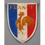 écusson brodé de l’équipe de France. Vers 1950. Dim. 8 x 10,5 cm.