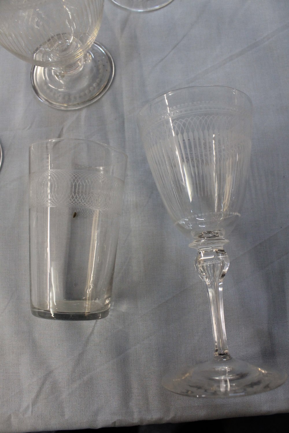 A GROUP OF SIMILAR 19TH CENTURY WHEEL ENGRAVED DRINKING GLASSES of different shapes and forms to - Image 3 of 3