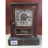 Small American mantel clock with floral panel on platform base. Seth Thomas,Thomaston.