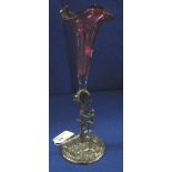 Cranberry glass flute vase with white metal base mounted with monkey chasing cat.