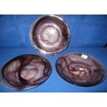 Three moulded cloud glass plates with fluted decoration.