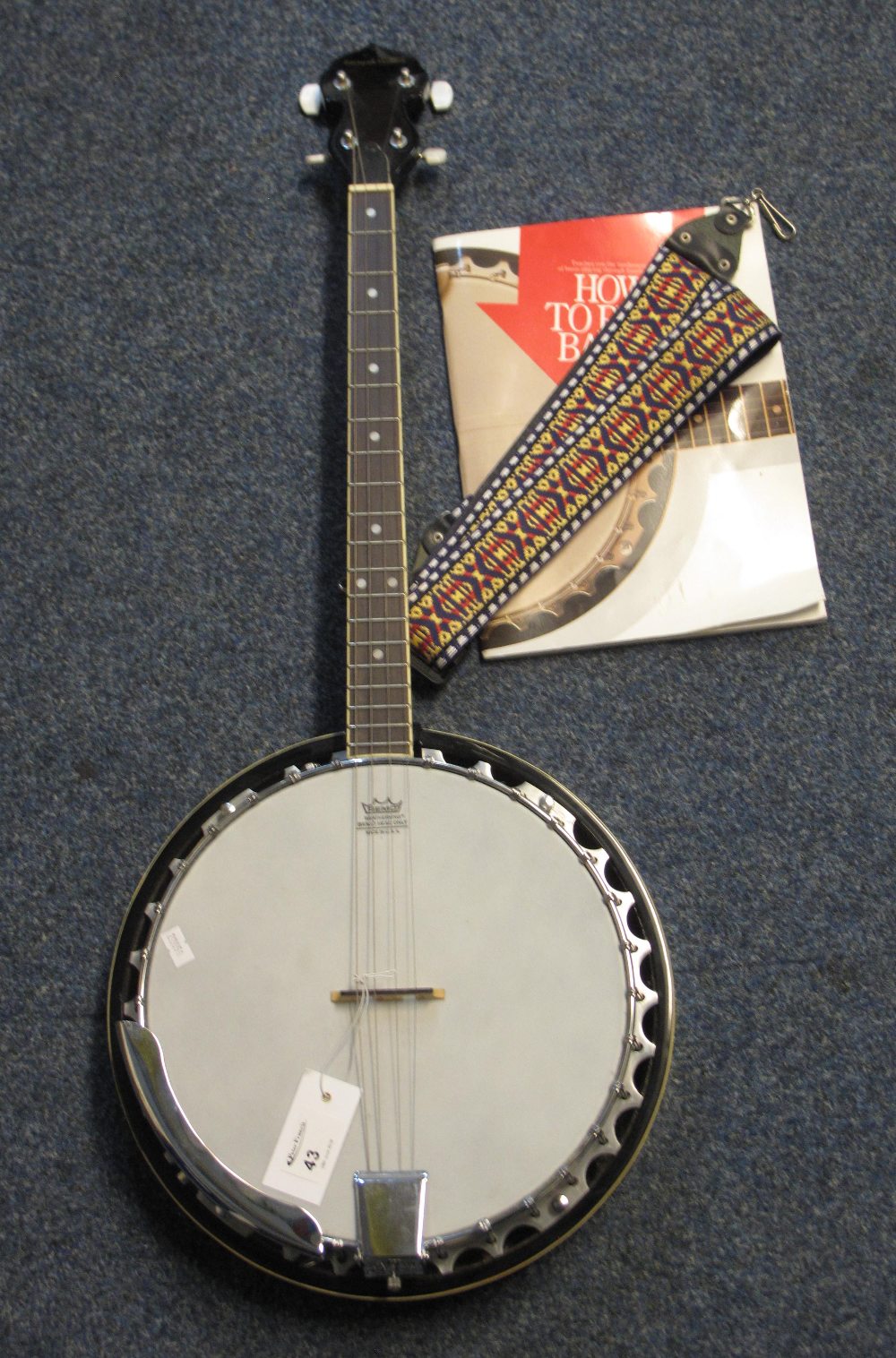 Remo Weatherking four string banjo, the head marked: Barnes and Mullins,