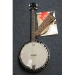 Remo Weatherking four string banjo, the head marked: Barnes and Mullins,