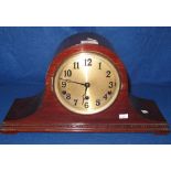 Mid 20th Century mahogany hat shaped three train mantel clock with silver Arabic face.