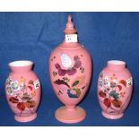 Pink opaline glass ovoid pedestal vase and cover together with a pair of similar ovoid pink opaline