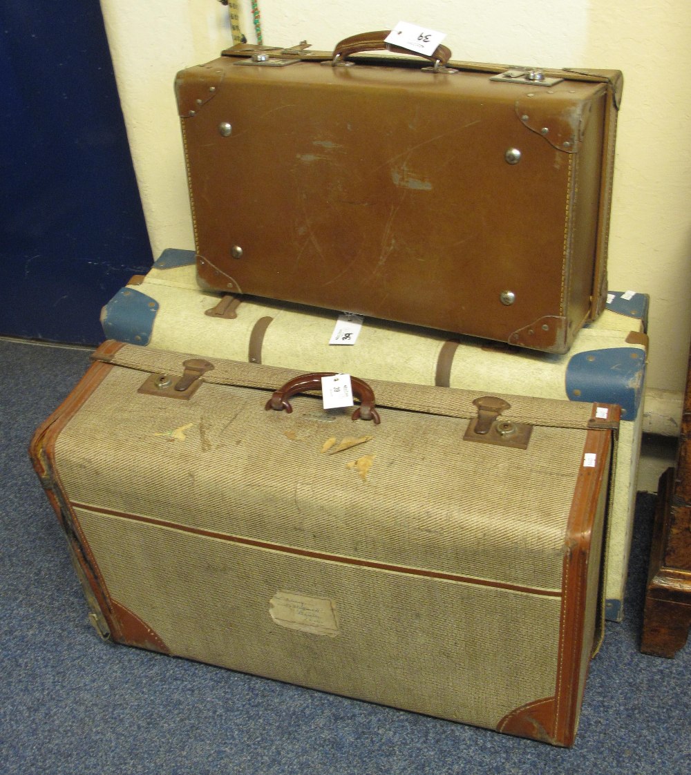 Three vintage suitcases.