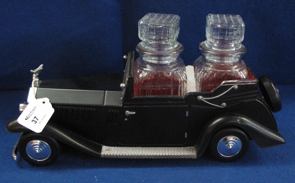 Novelty Rolls Royce motorcar musical decanter stand with two glass decanters.