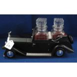 Novelty Rolls Royce motorcar musical decanter stand with two glass decanters.