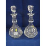 Pair of heavy cut lead crystal glass, mallet shaped, facet decanters with matching stoppers.