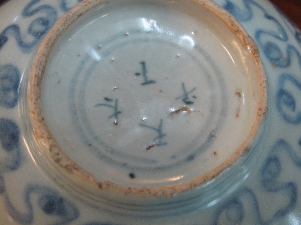 Chinese porcelain bowl in Ming style decorated in underglazed cobalt blue with four floral roundals, - Image 6 of 6