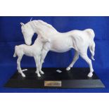 Beswick china 'Spirit of Affection' mare and foal group on wooden base.