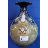 Royal Doulton stoneware baluster shaped vase with tube lined foliate decoration and flared neck.